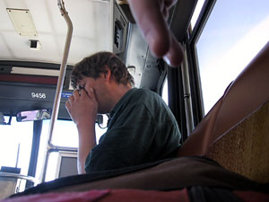 A man sitting on a bus