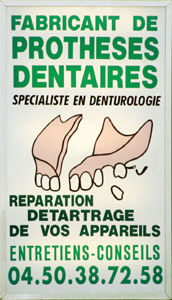 A Swiss dentist's sign advertising false teeth