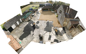 A collage of photos taken from our rooftop showing the yard being resurfaced