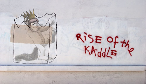 Graffiti on a wall saying 'Rise of the Kaddle'