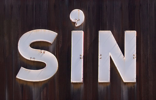 A shop sign which reads 'SIN'